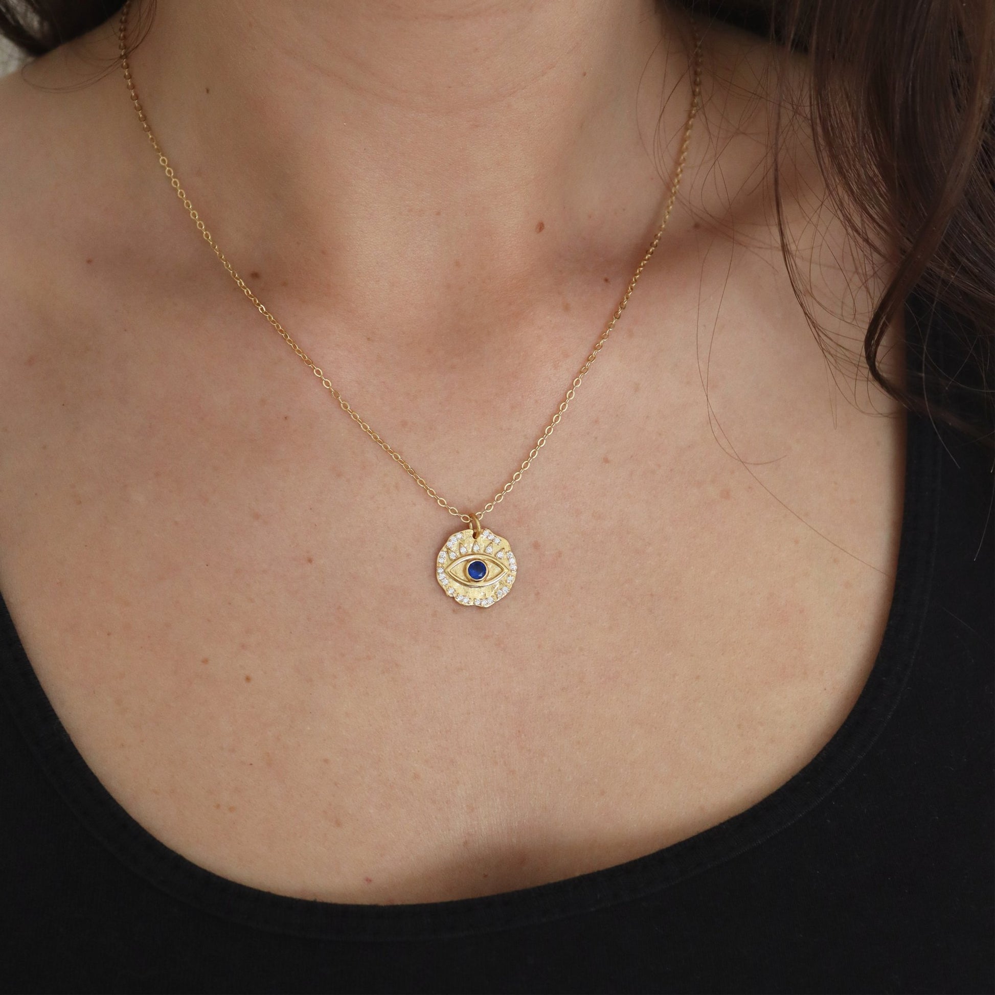 Women wearing Evil Eye Gold Sterling Silver Cubic Zirconia Blue Gemstone Round Pendant Necklace 